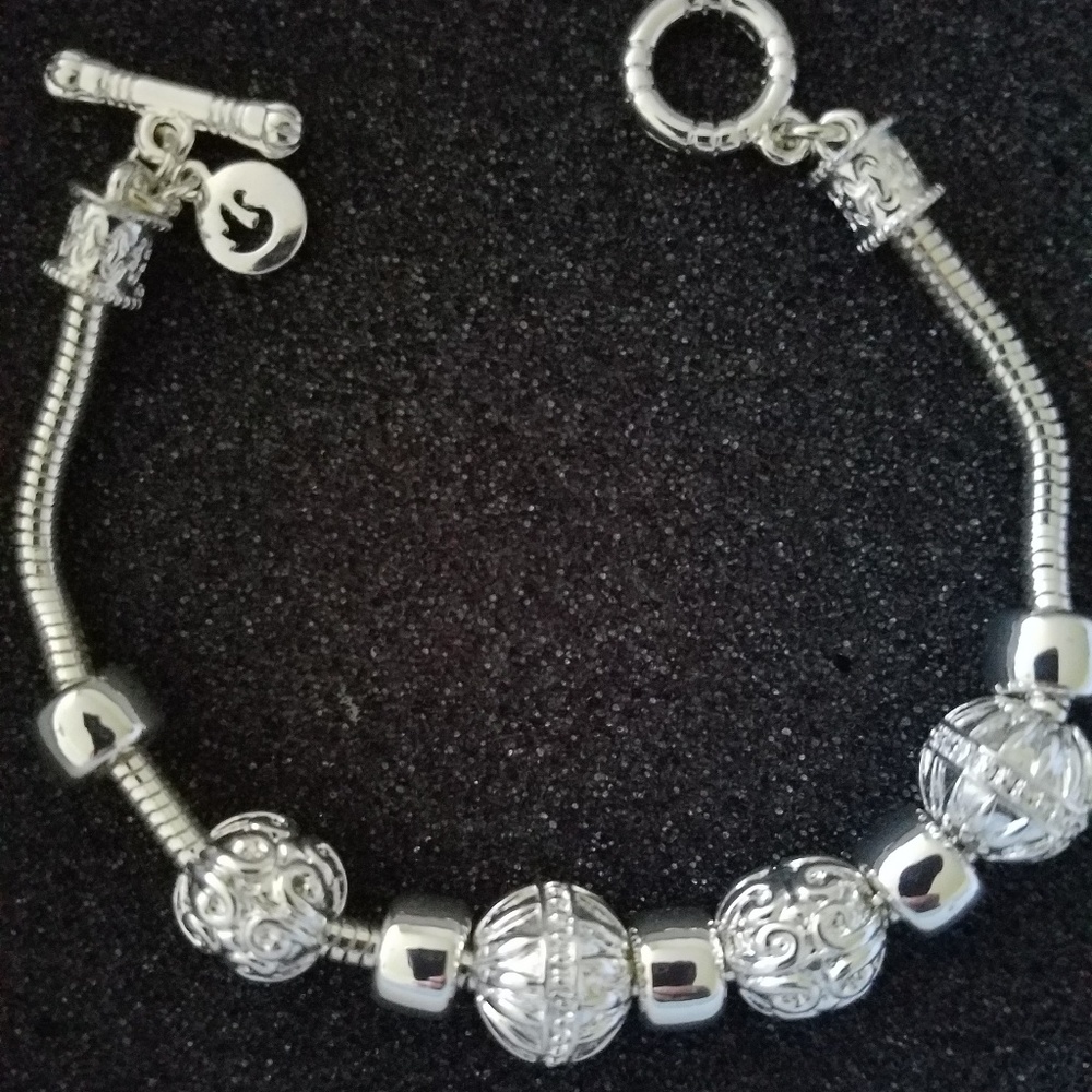 Silver toggle bracelet with charms